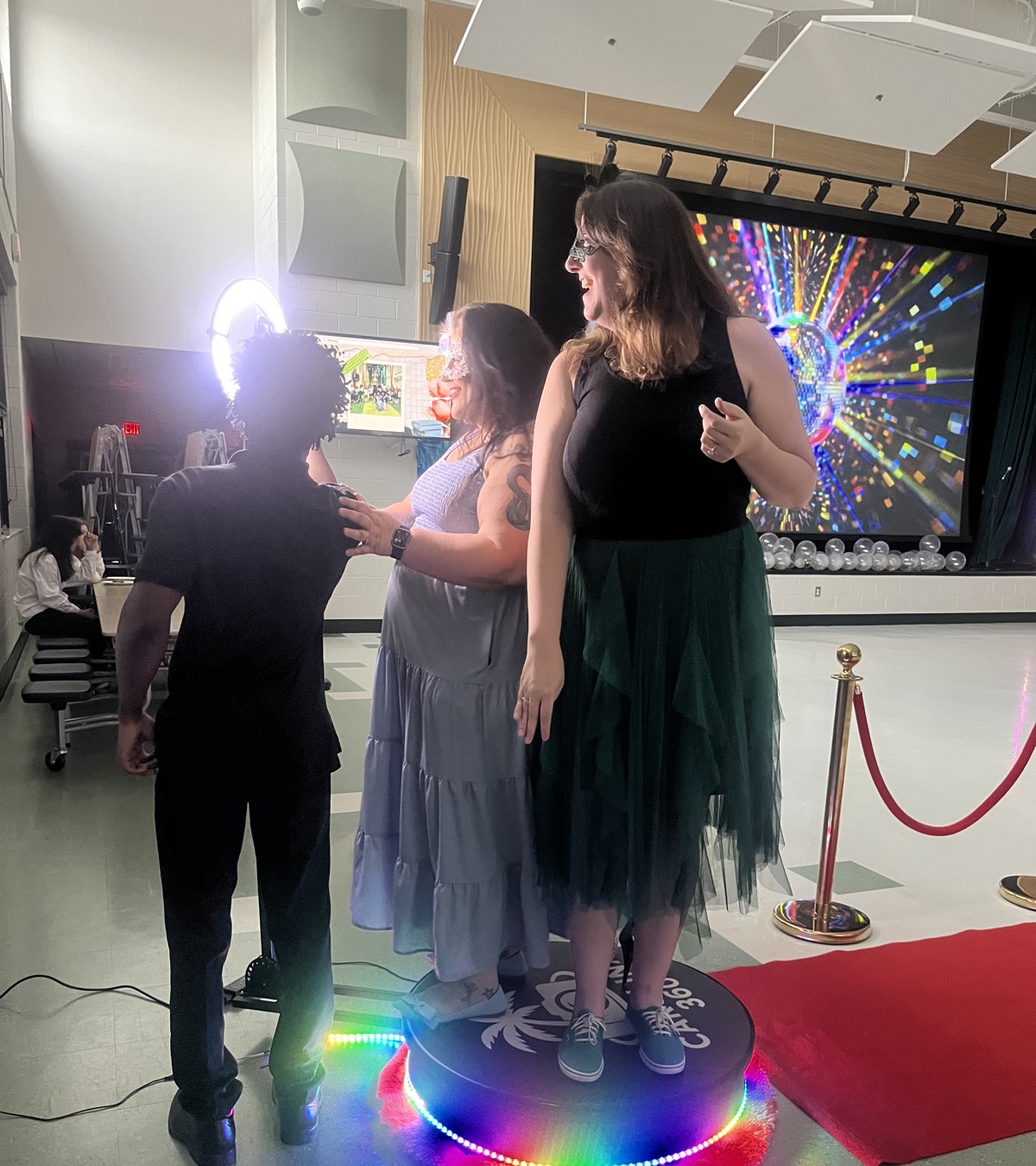 Two guests on the Carolina 360 photo booth platform
